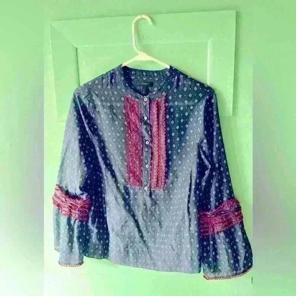 JCREW Women’s navy and red blouse with ruffle detail and button closure.…